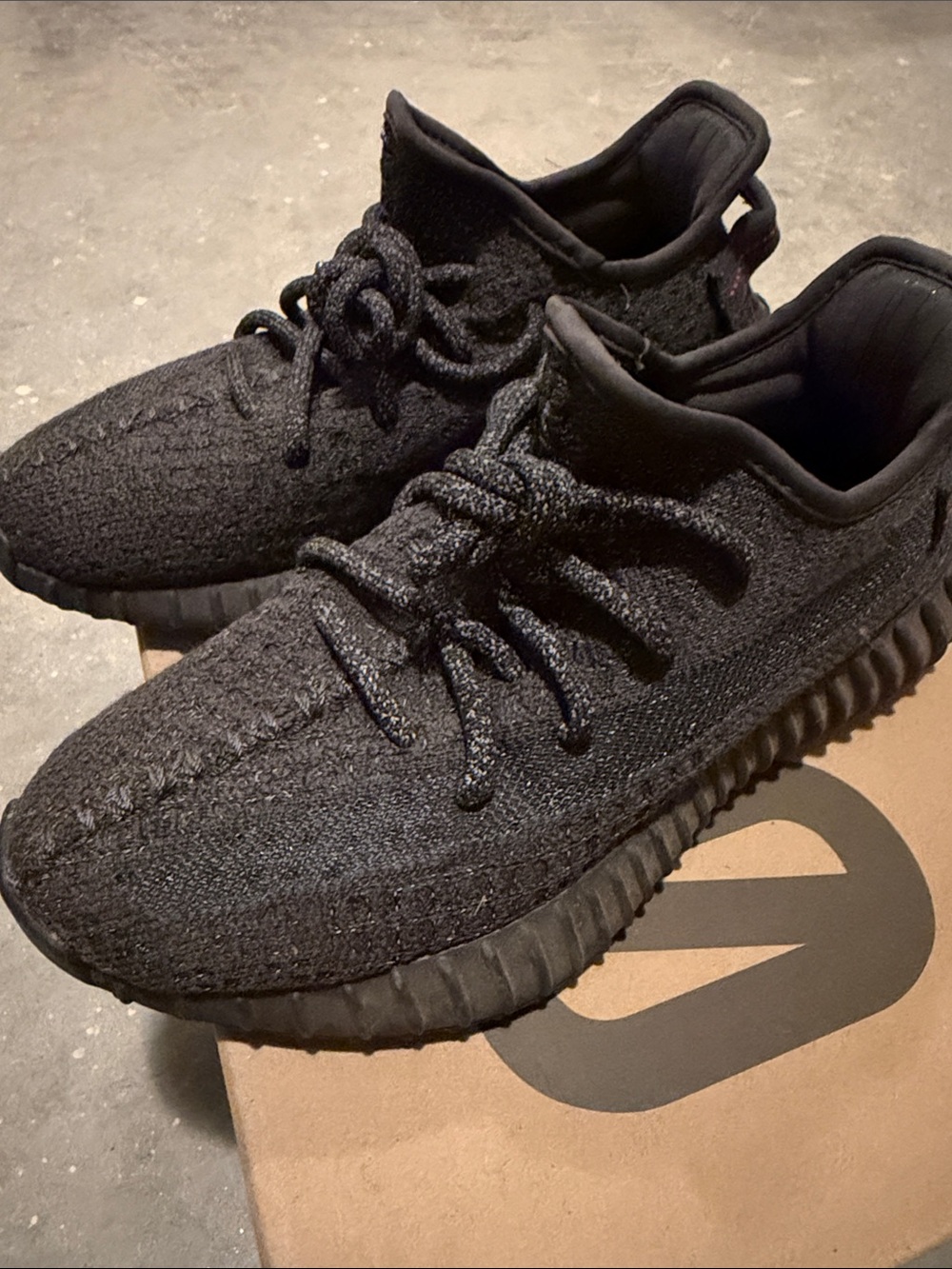 Yeezy Black Sneakers with Red Heel Stitch